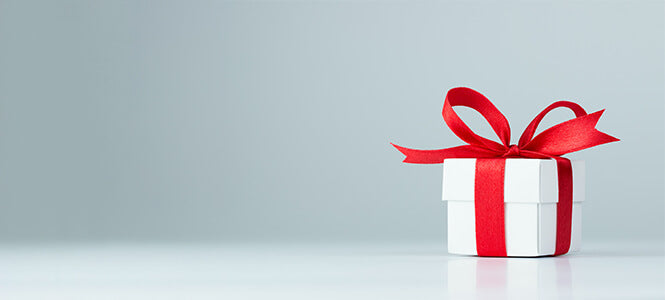 grey background with present box with red ribbon