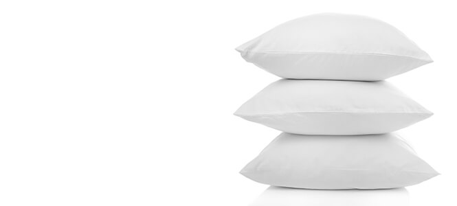 Bolster Pillows white stacked 3 high