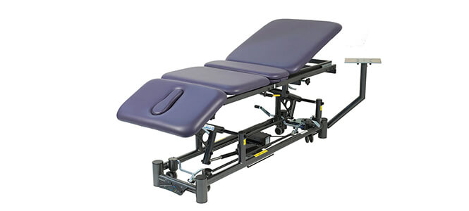 Cardon Chiropractic treatment table with back partially tilted on a black frame 2 wheels