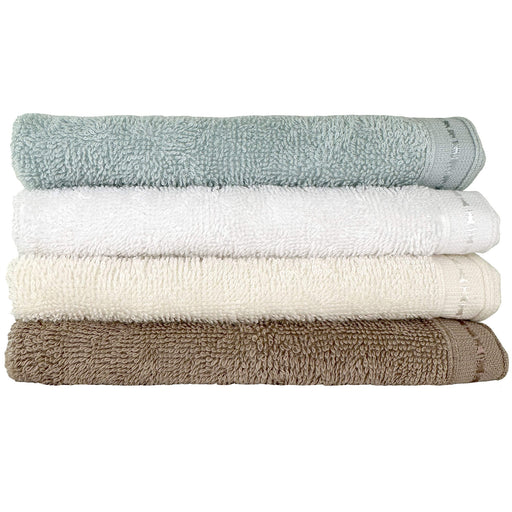 Four different colours of Organic cotton face towels 13 x 13 stacked