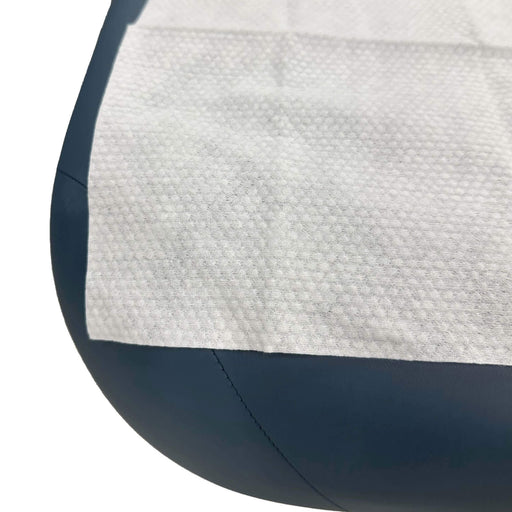 Premium Disposable Non Woven Pearl Towels 12 x 28 flat on treatment table corner