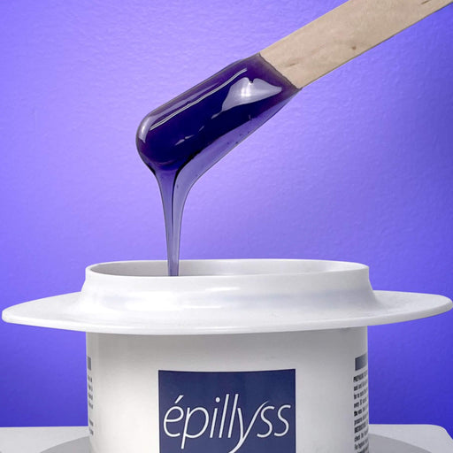 Purple Soft gel wax by Epillyss dripping from stick