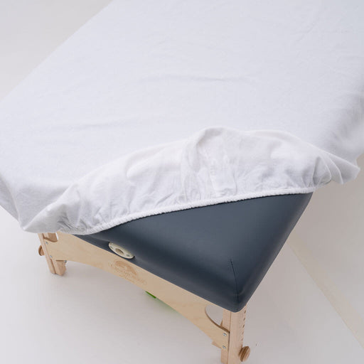 Flannel 145g Fitted Massage Table Sheets folded back from table