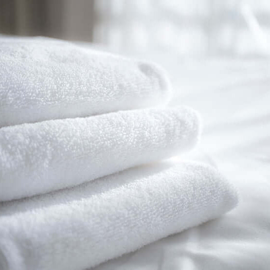 Stack of freshly laundered white spa towels