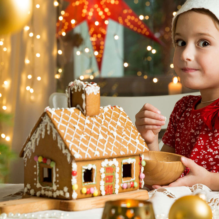 Old Fashioned Gingerbread with small girl decorating