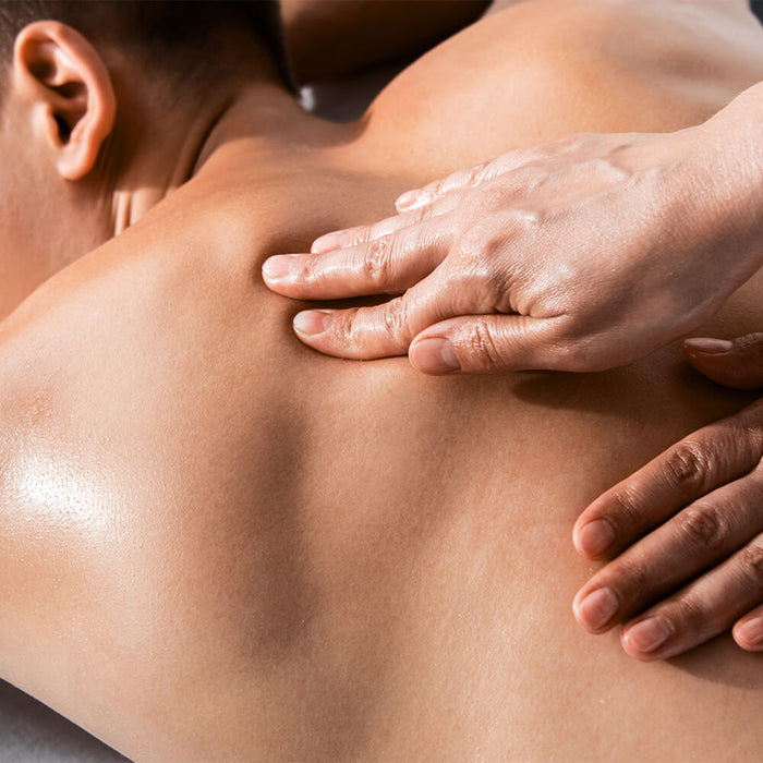 Man receiving a professional massage in a massage clinic
