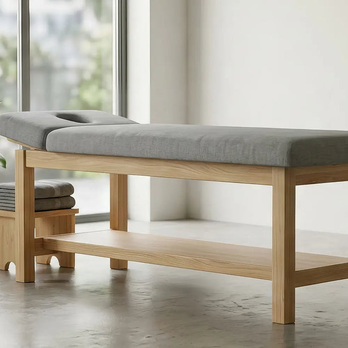Professional stationary massage table illustrating treatment table construction and weight capacity for Canadian therapy clinics