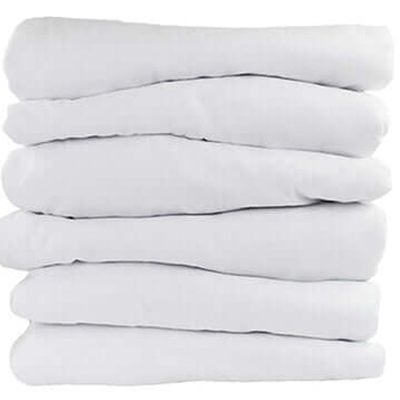 Stack of fitted sheets against white background