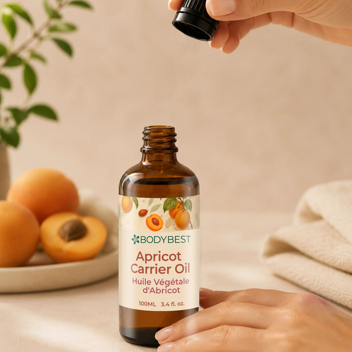BodyBest Apricot Carrier Oil lid is in use, women's hand is holding the BodyBest Apricot Carrier Oil lid and bottle