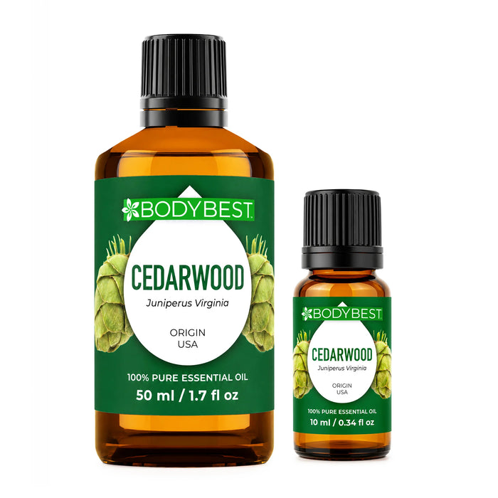 Body Best Cedarwood Essential Oil, 50 ml and 10ml amber glass bottle with brown cap and green label featuring cedarwood botanical imagery on a white background.