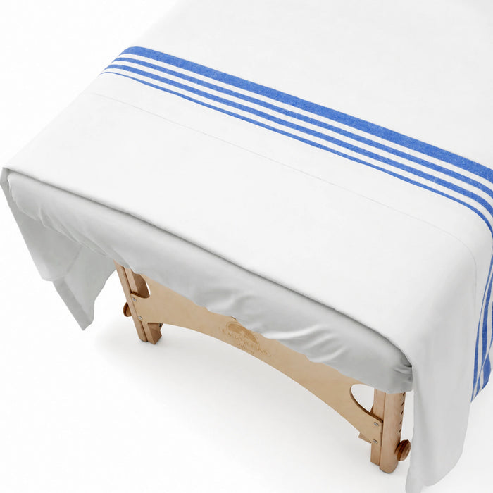 Body Best Flannel Hospital Blanket Draped Over Massage Table in Professional Spa Setting
