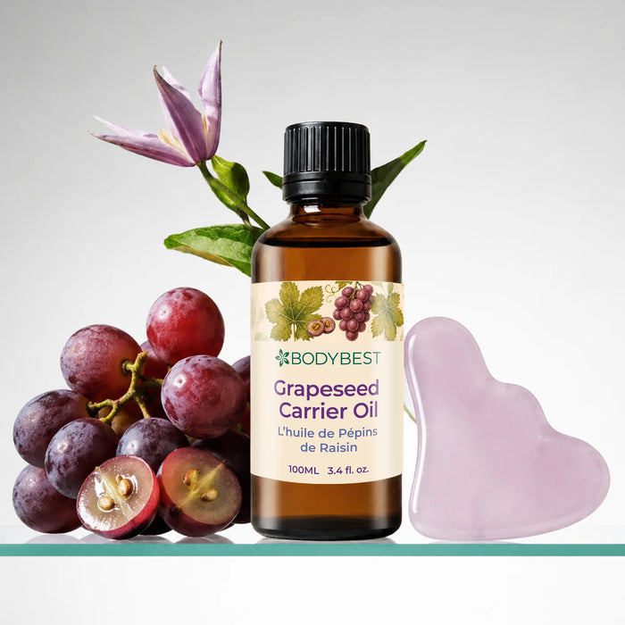 Lifestyle image of BodyBest Grapeseed carrier oil 100ml with grapes and guasha