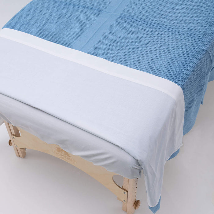 Blue Cotton Thermal Blanket on table