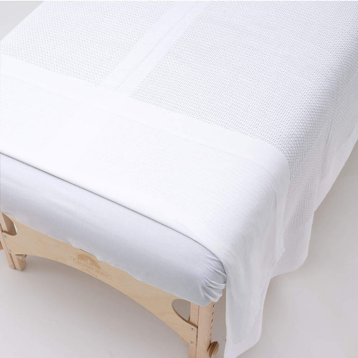 White Cotton Thermal blanket on table folded over