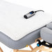 Earthlite Professional Table Warmer with soft white fleece covering a professional massage table, featuring a digital heat controller.