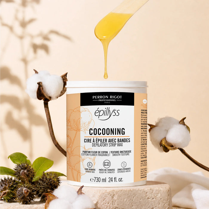Lifestyle image of Epillyss Cocooning lukewarm depilatory gel wax 730ml 24oz with cotton and castor, wooden spatula with wax drops