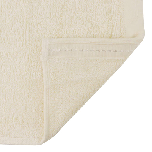 Organic face towel 13" x 13" Natural folded corner showing stitched hem