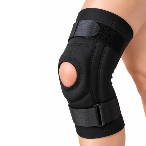 MKO patella stabilizer knee brace in  black color shown on a person's leg against a plain white background.