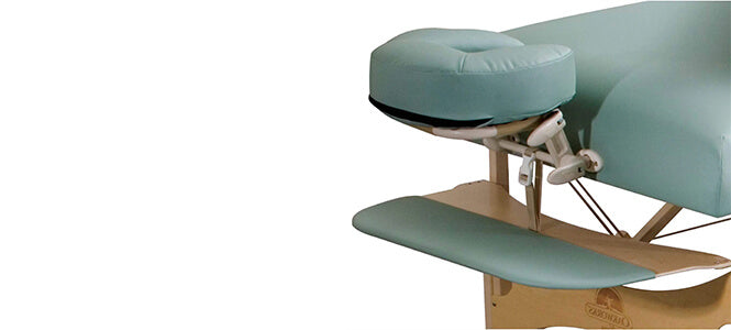 Hanging arm rest on a portable treatment table