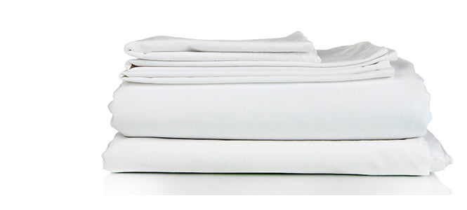 Massage sheets stacked different size sheets and pillowcases