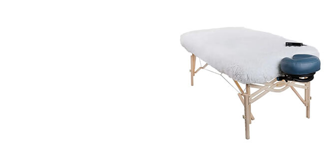 Fleece table warmer with control on a portable treatment table