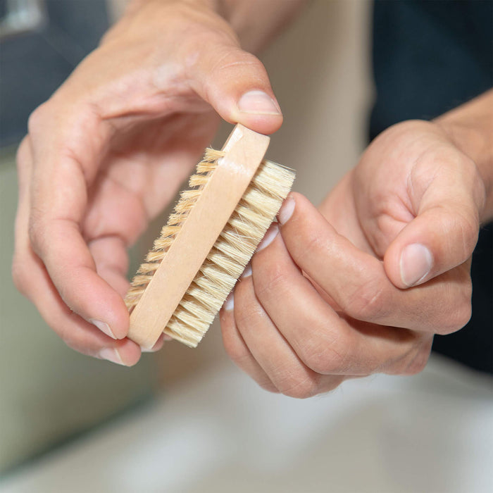 Nail Brush being used on nails