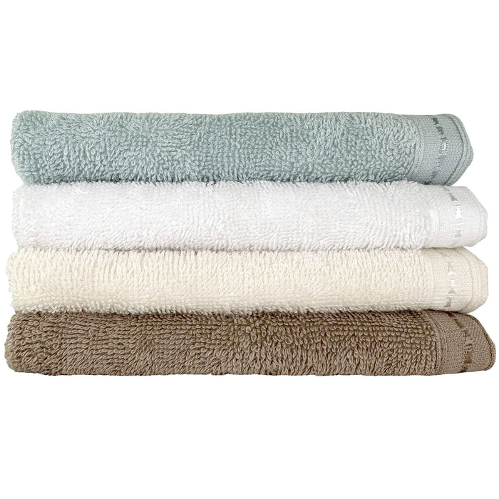 Four different colours of Organic cotton face towels 13 x 13 stacked