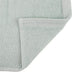 Organic face towel 13" x 13" Sage folded corner showing stitched hem