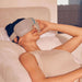 Female sleeper enjoying Therabody Smart Goggles