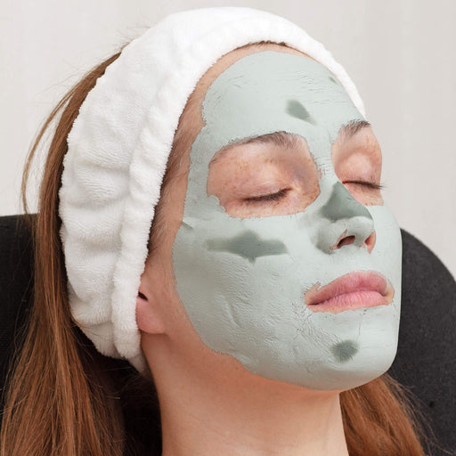 Spa Headband being wore by a female with green facial mask 