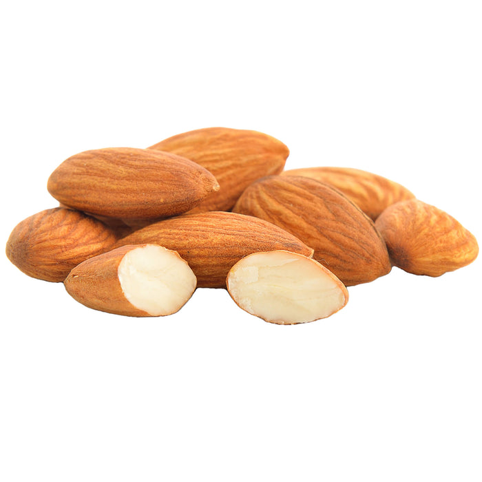 Almond nuts bunched together one split showing the inside