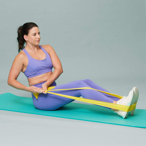 TheraBand Resistance Bands Yellow in use by female model