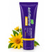 A purple squeeze tube of Anti-Flamme Arnica Cream with Arnica 15% Arnica Oil against a white background, styled with yellow arnica flowers and green leaves at the base.