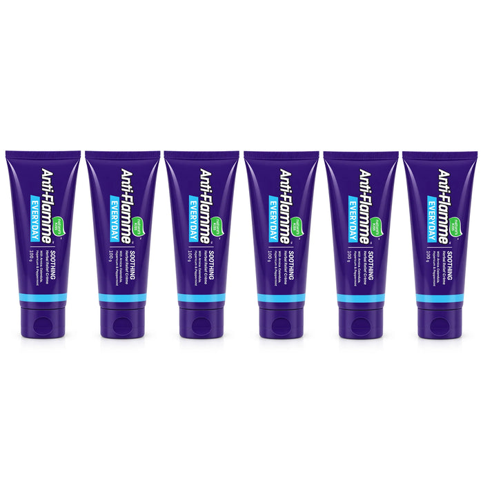 Six purple tubes of Anti-Flamme  soothing cream 100g arranged in a row on a white background.