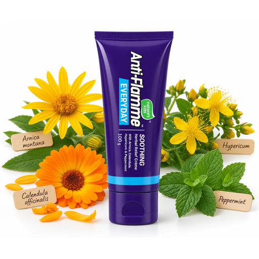 A purple squeeze tube of Anti-Flamme Soothing Herbal Pain Cream 100g centered on a white background, surrounded by yellow flowers, green leaves, and small paper labels reading Armica montana, Calendula officinalis, Hypericum, and Peppermint.