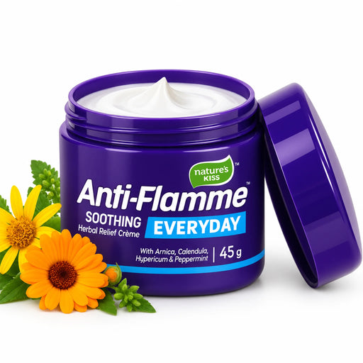 A purple jar of Nature's Kiss Anti-Flamme Soothing Everyday Herbal Relief Crème 45g with its lid leaning against it, shown on a white background with yellow flowers and green leaves as props.