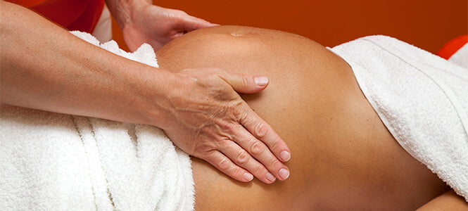 Therapist giving a pregnancy massage