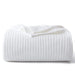 White waffle weave blanket on a white background