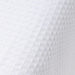 Close-up of textured white fabric with a subtle pattern