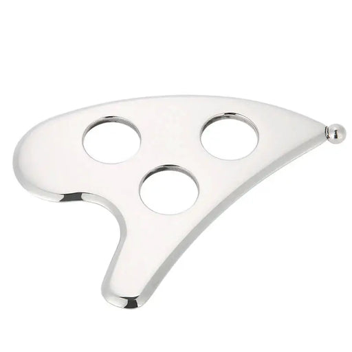 Metallic, fan-shaped gua sha tool with three circular holes on a white background