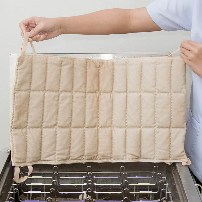 Person holding a moist heat hydrocollator hot pac from Chattanooga.