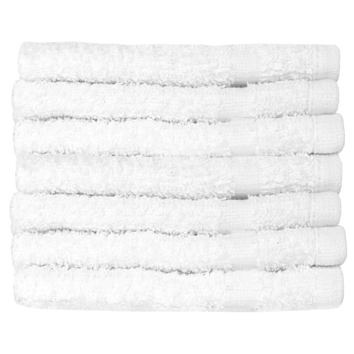 Lightweight bath towels folded and stacked on white background