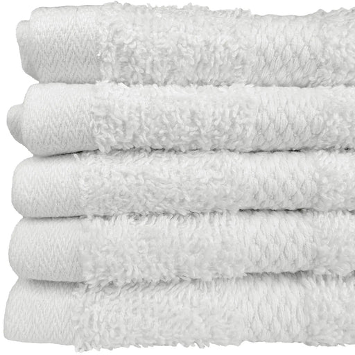 Stack of white face towels with a textured surface