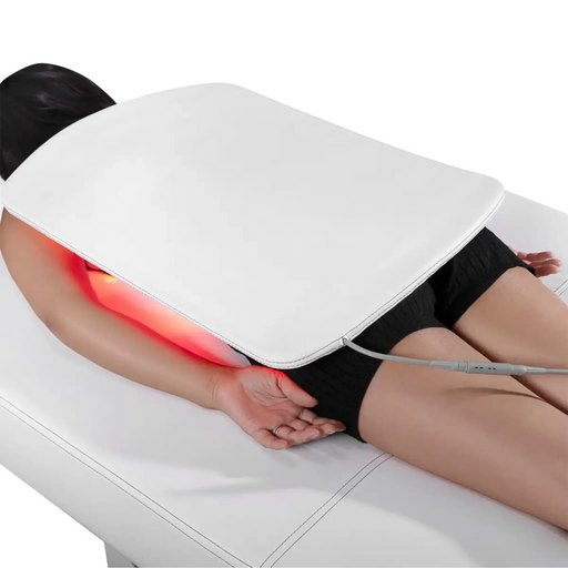 Person receiving a back massage with a white massage device on a white background