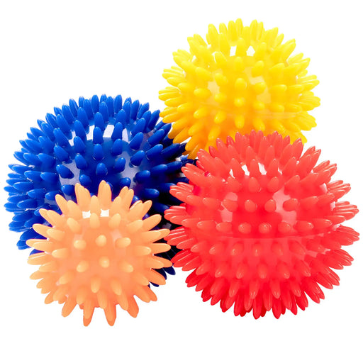 Set of colorful spiky massage balls on a white background
