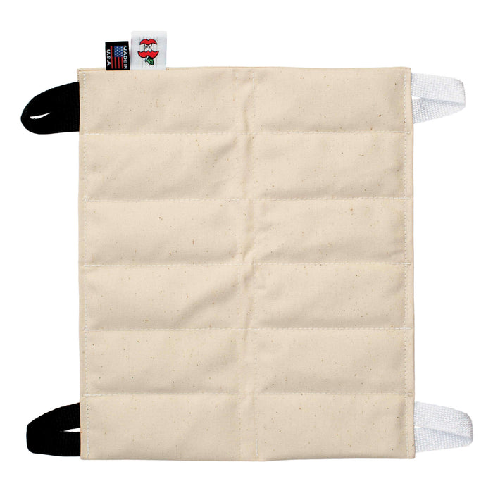 Beige fabric hydrocollator hot pack on a white background