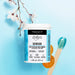 Lifestyle image of Epillyss senior depilatory soft wax with wooden spatula and cherry blossom 