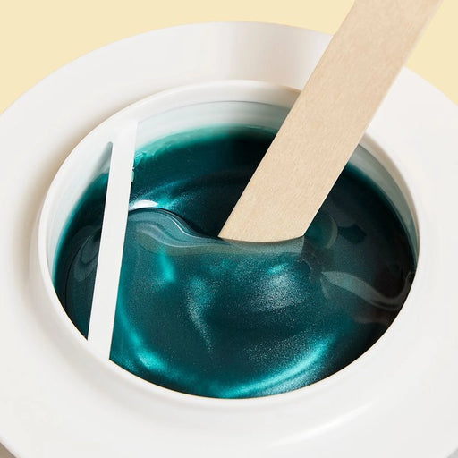 Wax wooden spatula is being used for Epillyss senior depilatory soft wax 