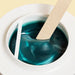 Wax wooden spatula is being used for Epillyss senior depilatory soft wax 