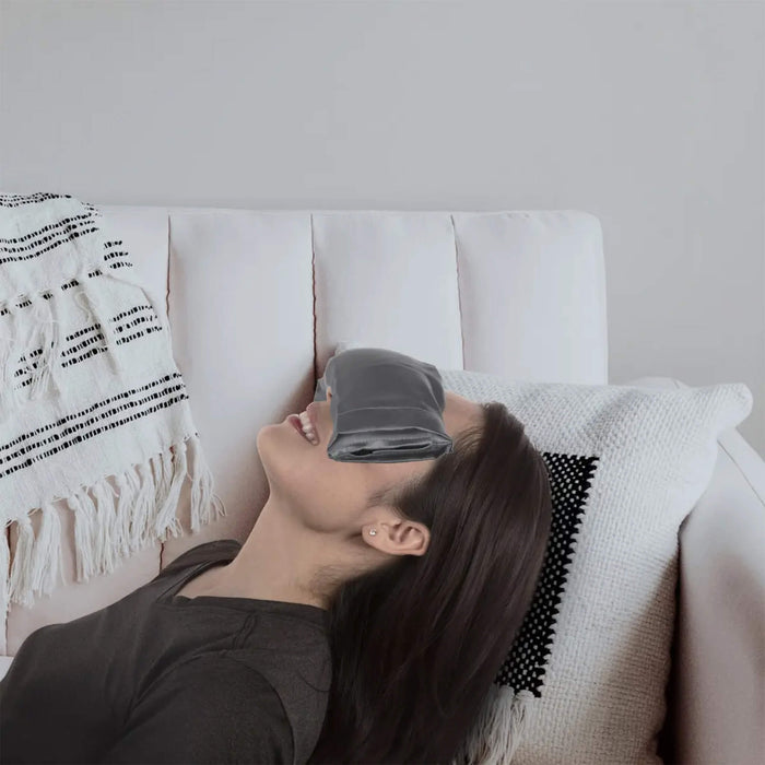 Woman relaxing with a Holistic Alchemy Therapeutic Eye Pillow